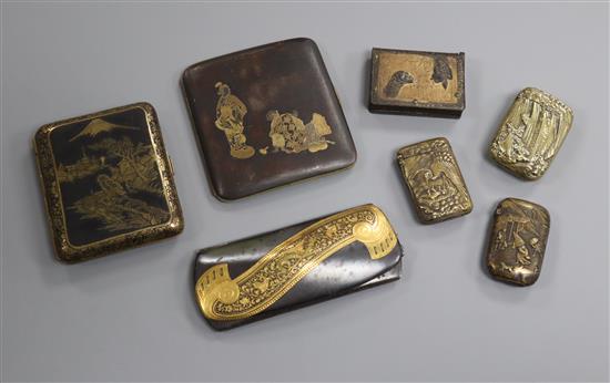 Three gold damascened iron cases and four Japanese vesta cases